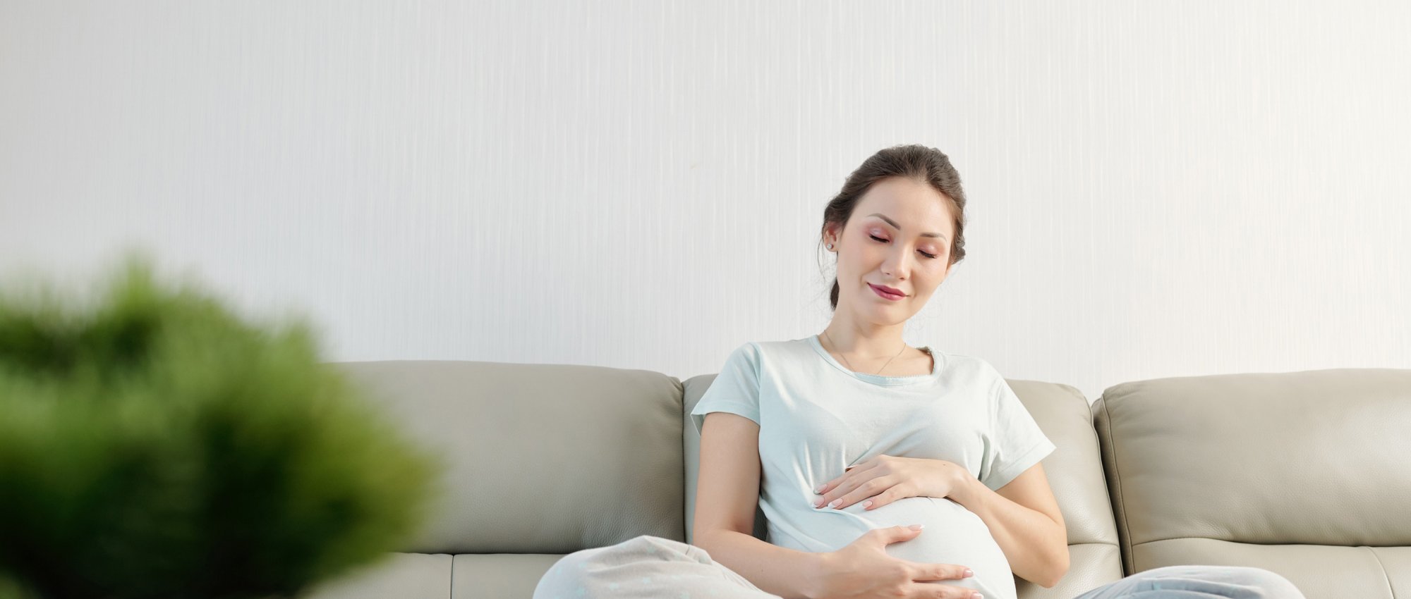 Pregnant woman using hypnobirthing techniques to relax