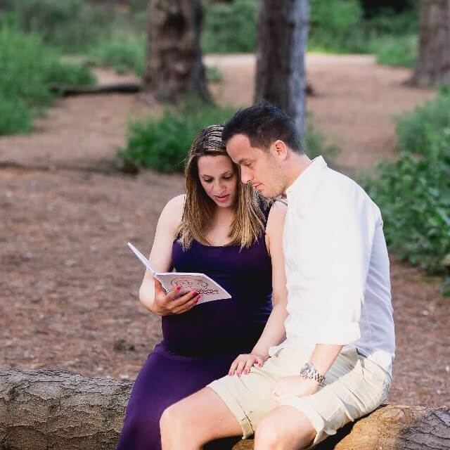 couple reading in woods